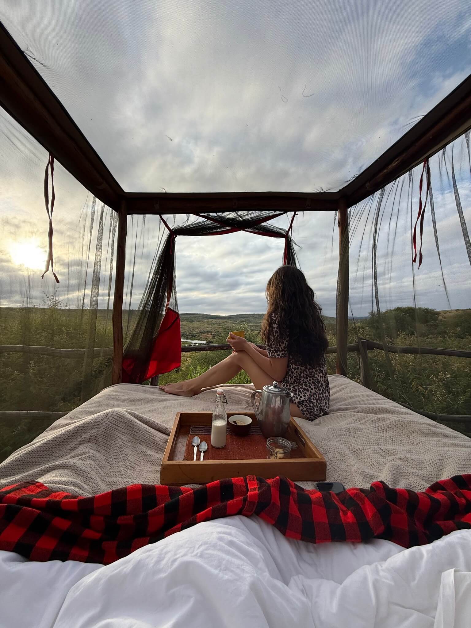A tourist enjoy a chill morning in Loisaba Star Beds
